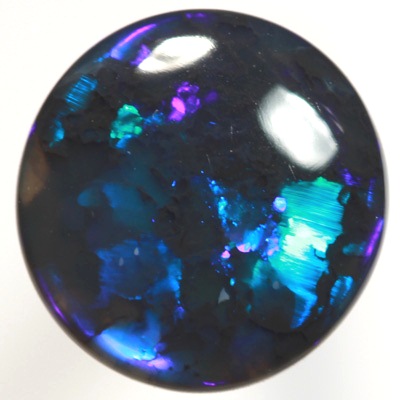 SOLID BLACK OPAL Very bright electric turquoise fire. SEE VIDEO
